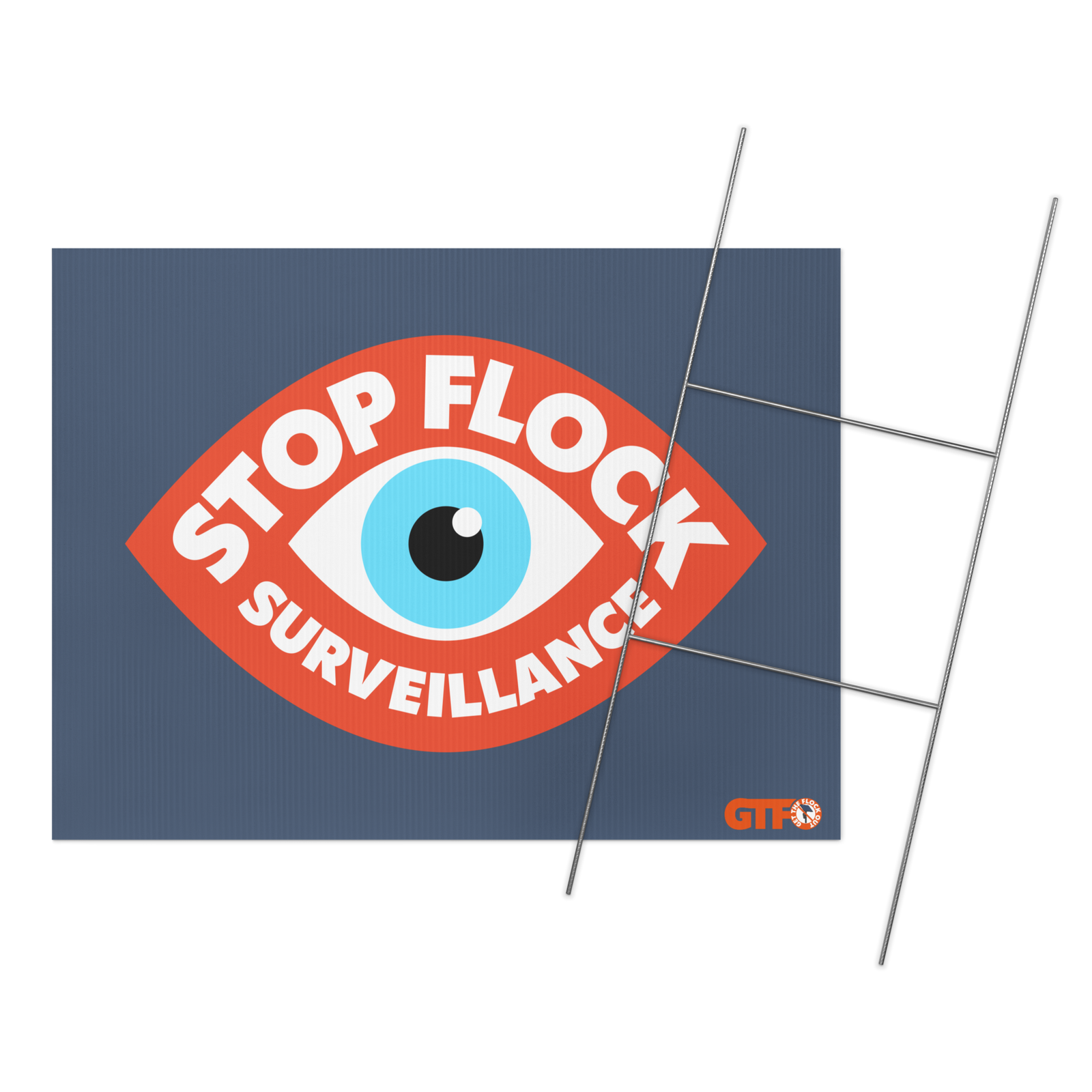 A rectangular navy blue flag featuring a large red eye graphic with the words 'STOP FLOCK SURVEILLANCE' in white, plus a small orange and white logo in the lower right. Thin metal flag stakes are shown extending from the right side on a white background.