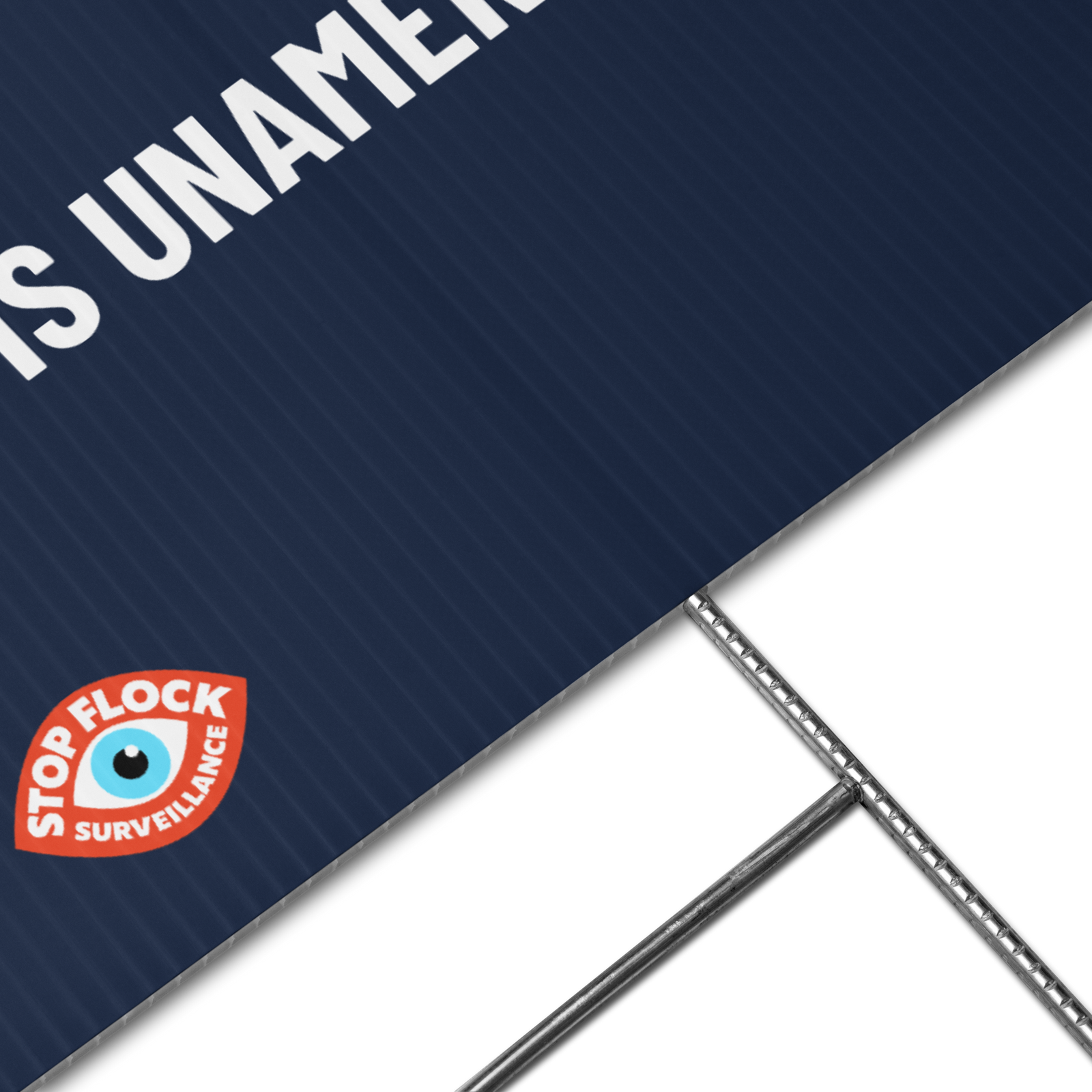 Close-up of a dark navy blue sign or panel with white partial text reading 'IS UNAM.