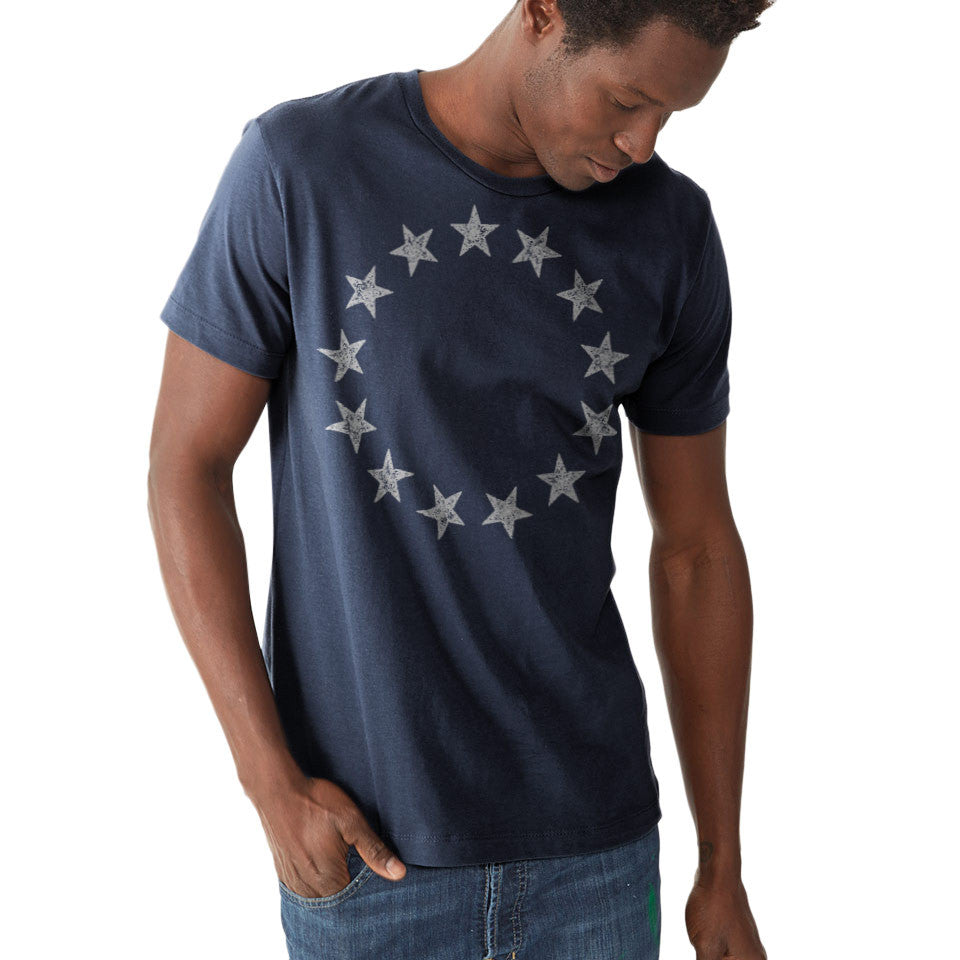 13 Stars Vintage Betsy Ross Revolution Shirt in navy on model with colonial flag circle design