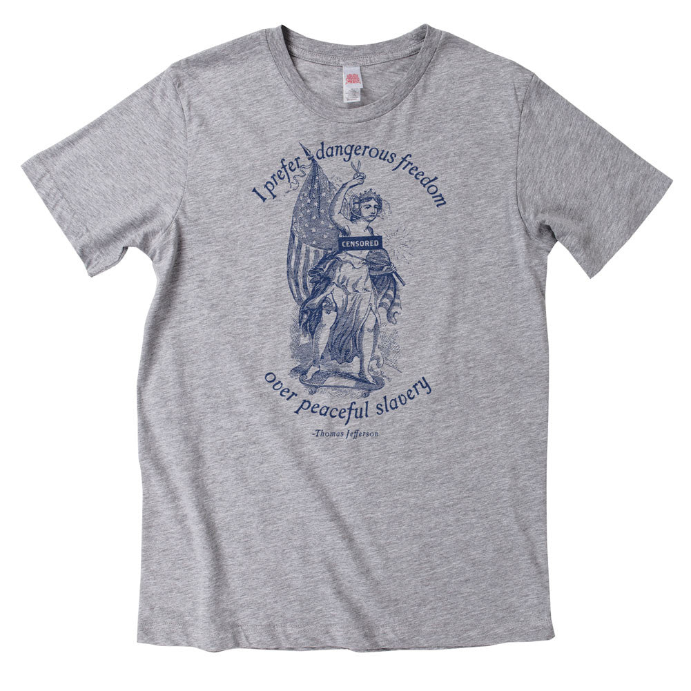 A heather grey t-shirt with a graphic print of a person and the text 'I prefer dangerous freedom over peaceful slavery - Thomas Jefferson' by Liberty Maniacs