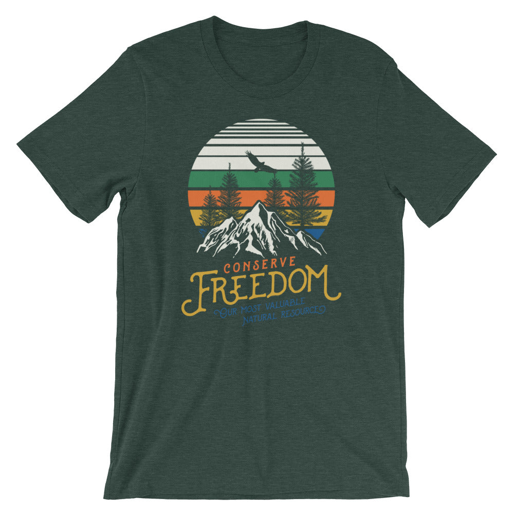 A green crew neck t-shirt with a graphic print of mountains and text that reads 'CONSERVE FREEDOM'.
